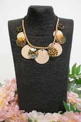 Animal print layered disc necklace in Brown