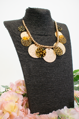 Animal print layered disc necklace in Brown